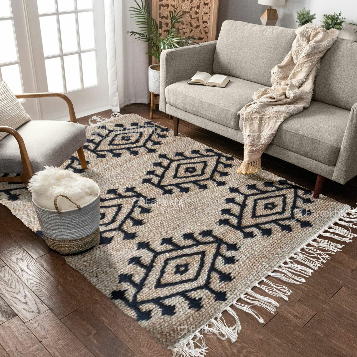 Living room with a patterned rug, gray sofa, and armchair.