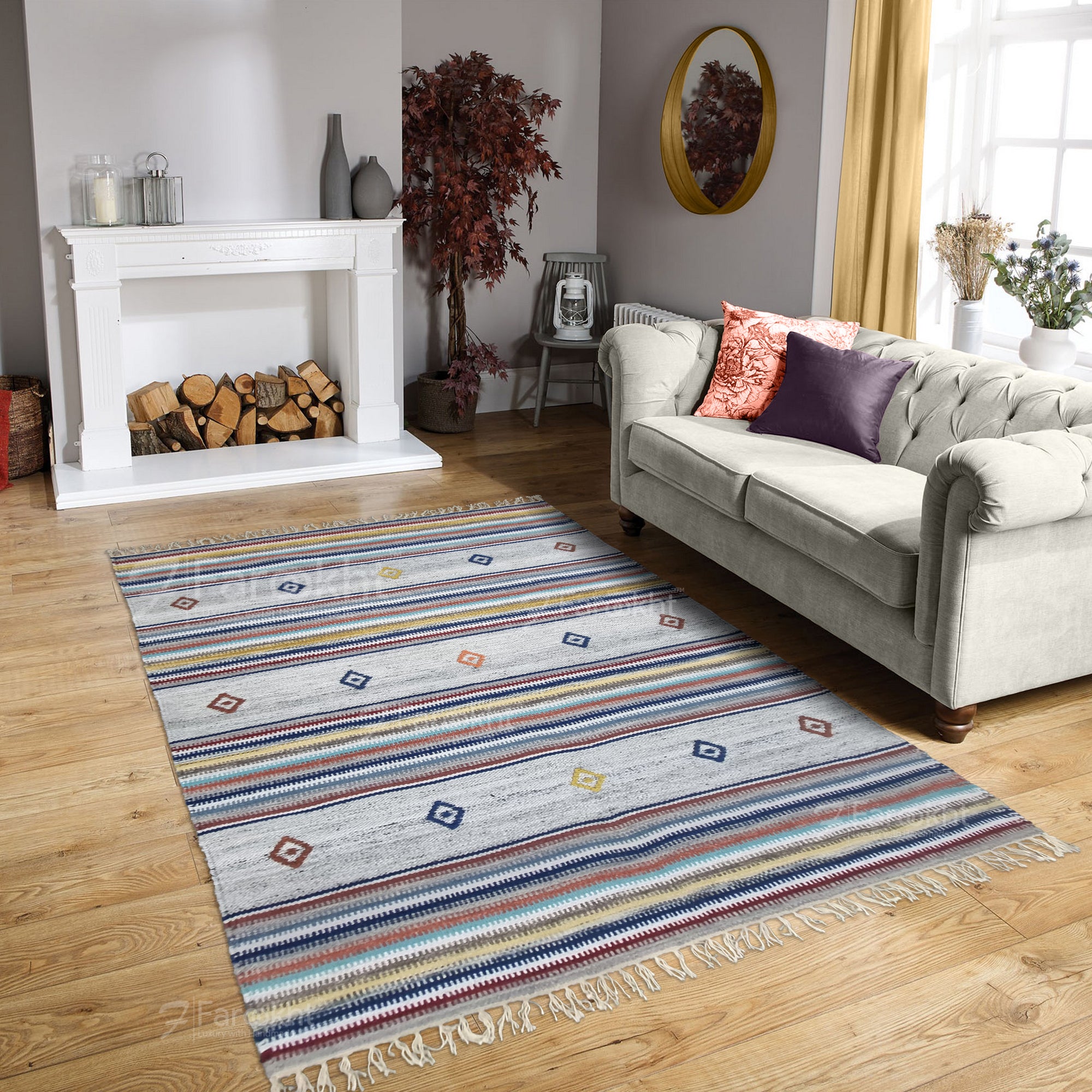 Living room with a colorful striped rug, gray sofa, and fireplace.