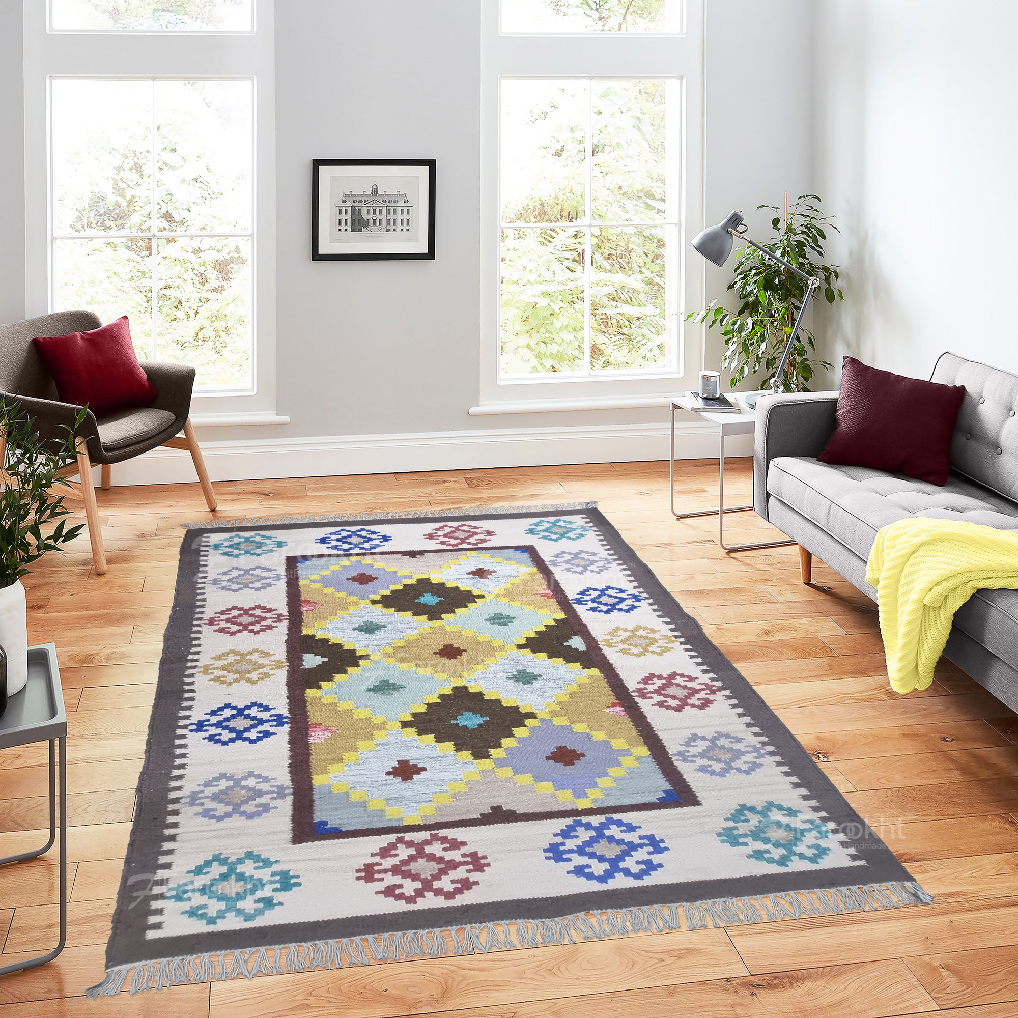 Decorative rug with geometric pattern on a wooden floor in a living room.