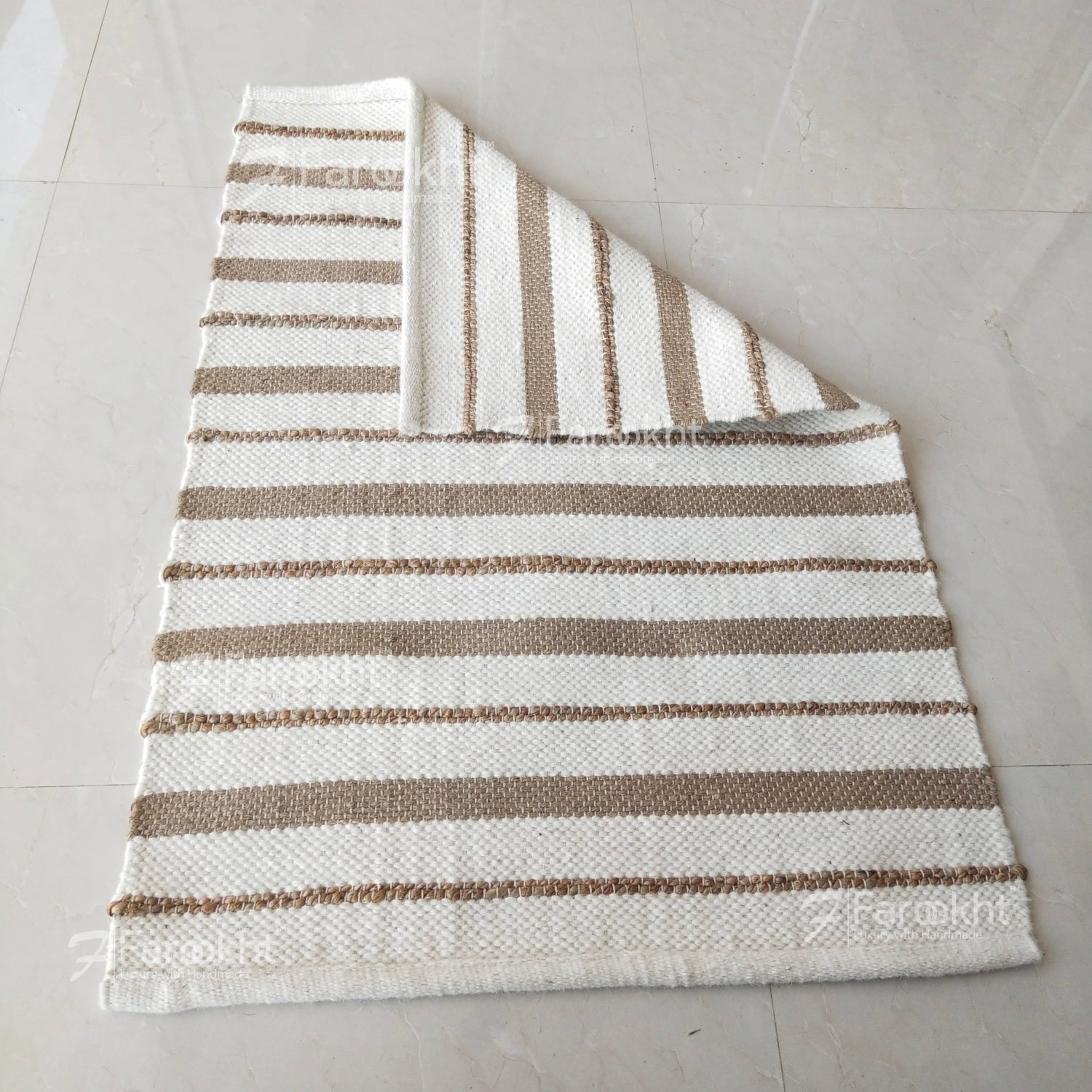 Striped rug with brown and white stripes on a light gray floor.