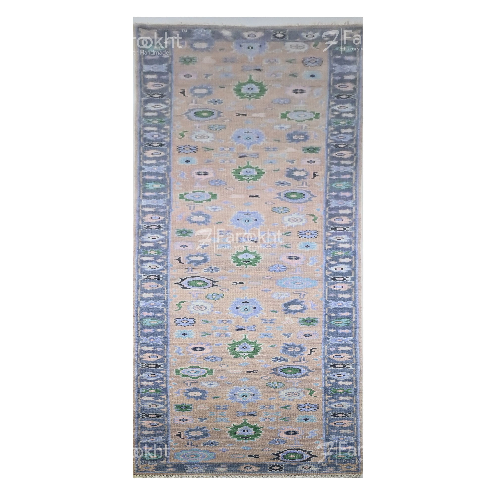 Decorative rug with floral patterns on a beige background, featuring the brand &