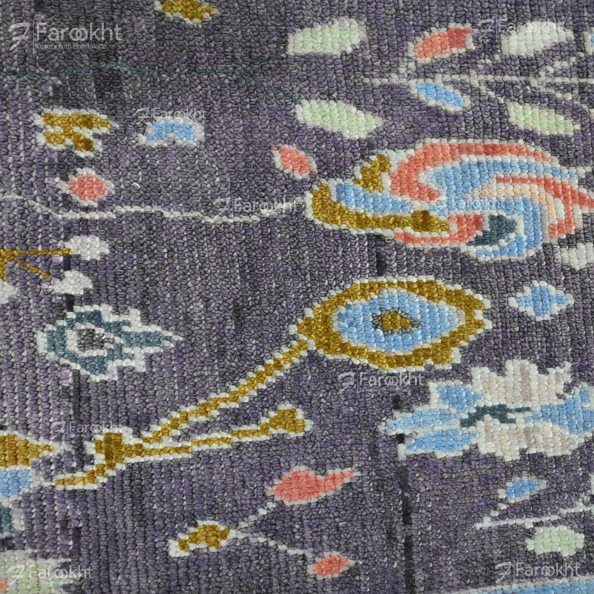 Close-up of a patterned fabric with colorful designs on a dark background