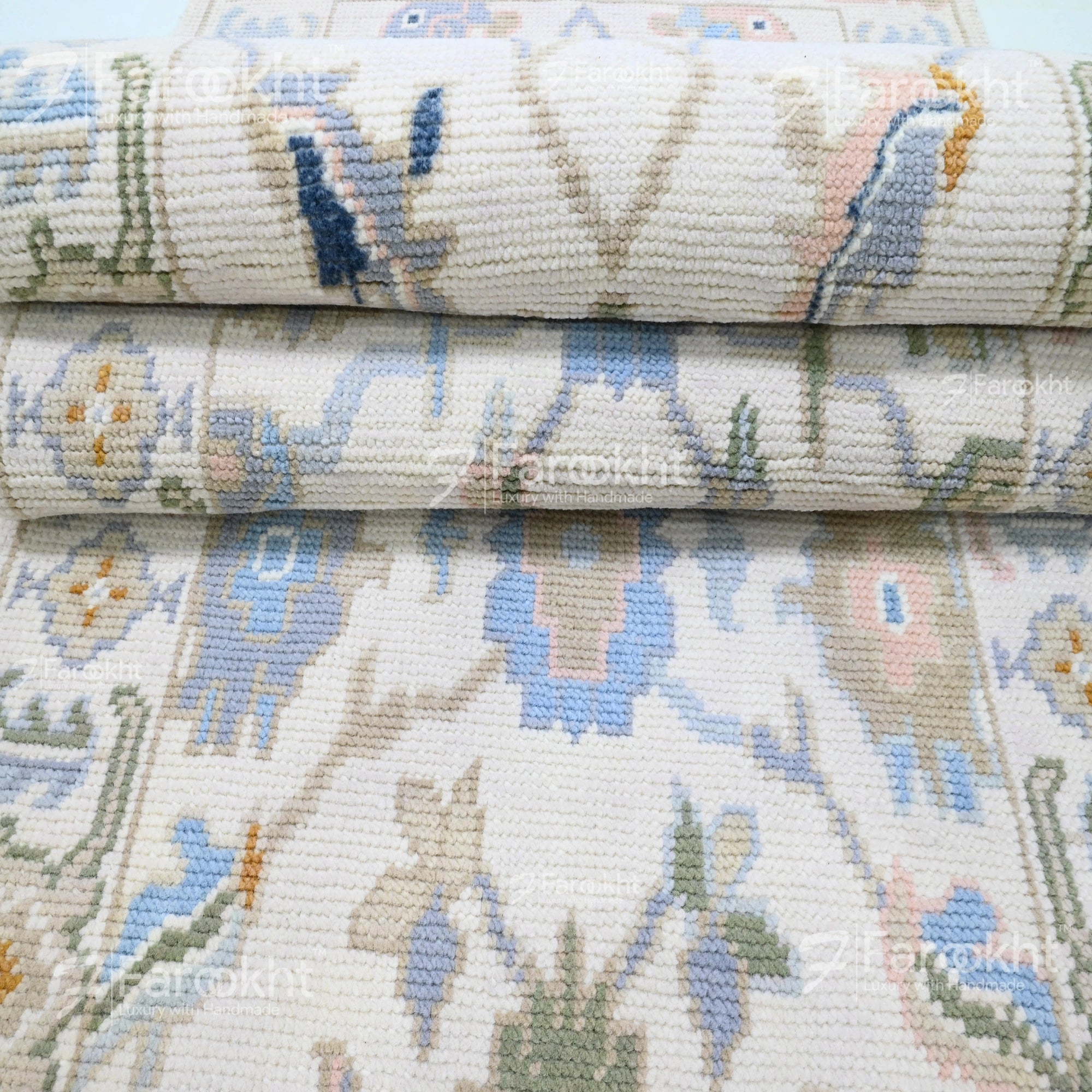 Close-up of a stack of patterned fabric rolls with floral designs.