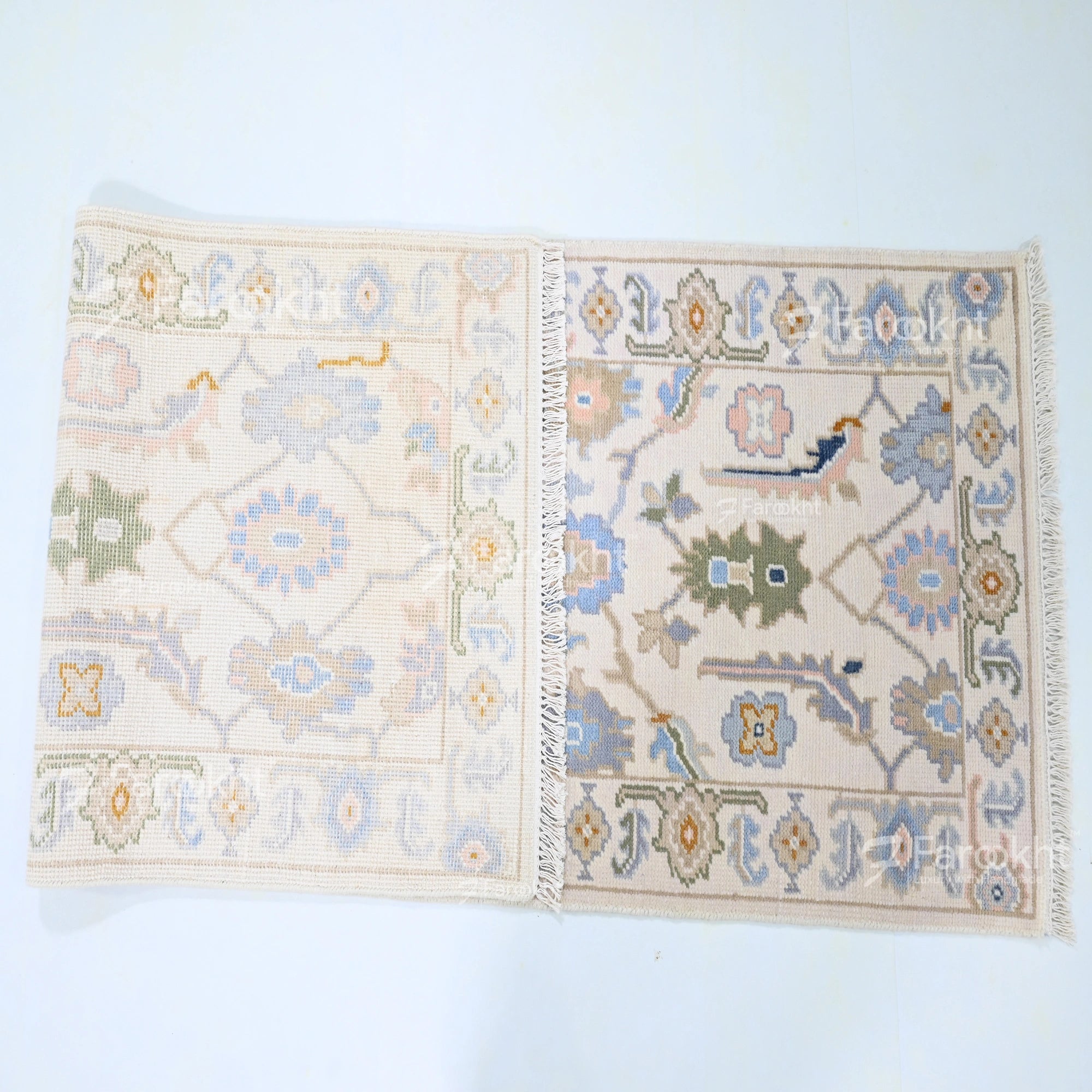 Two decorative rugs with intricate patterns on a light blue background