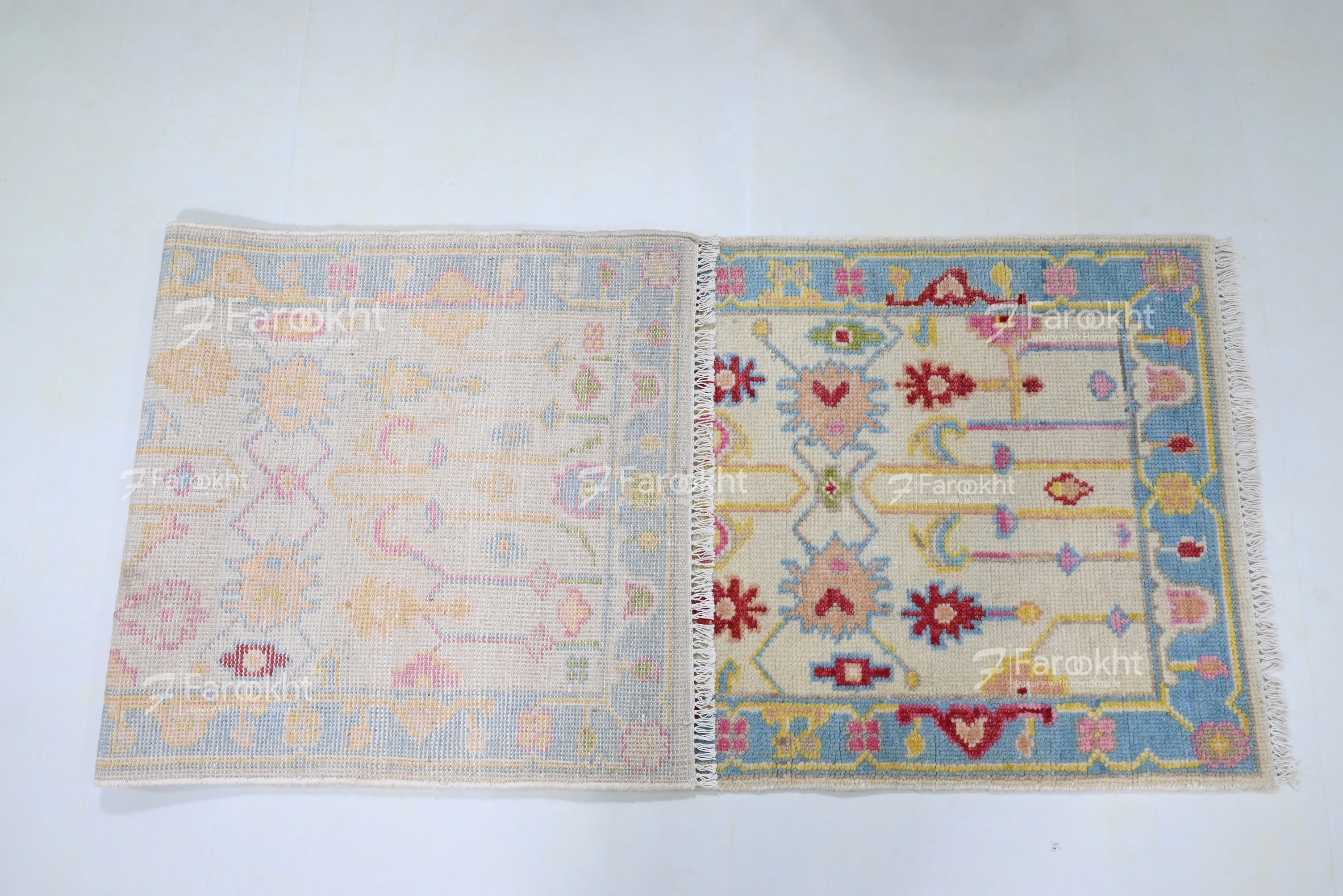 Soft ivory wool blend rug with colorful motifs