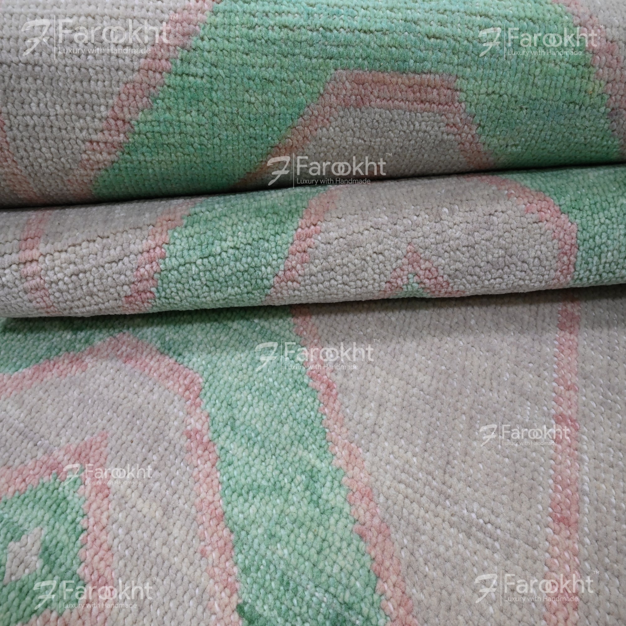Stack of green and gray patterned fabric with &