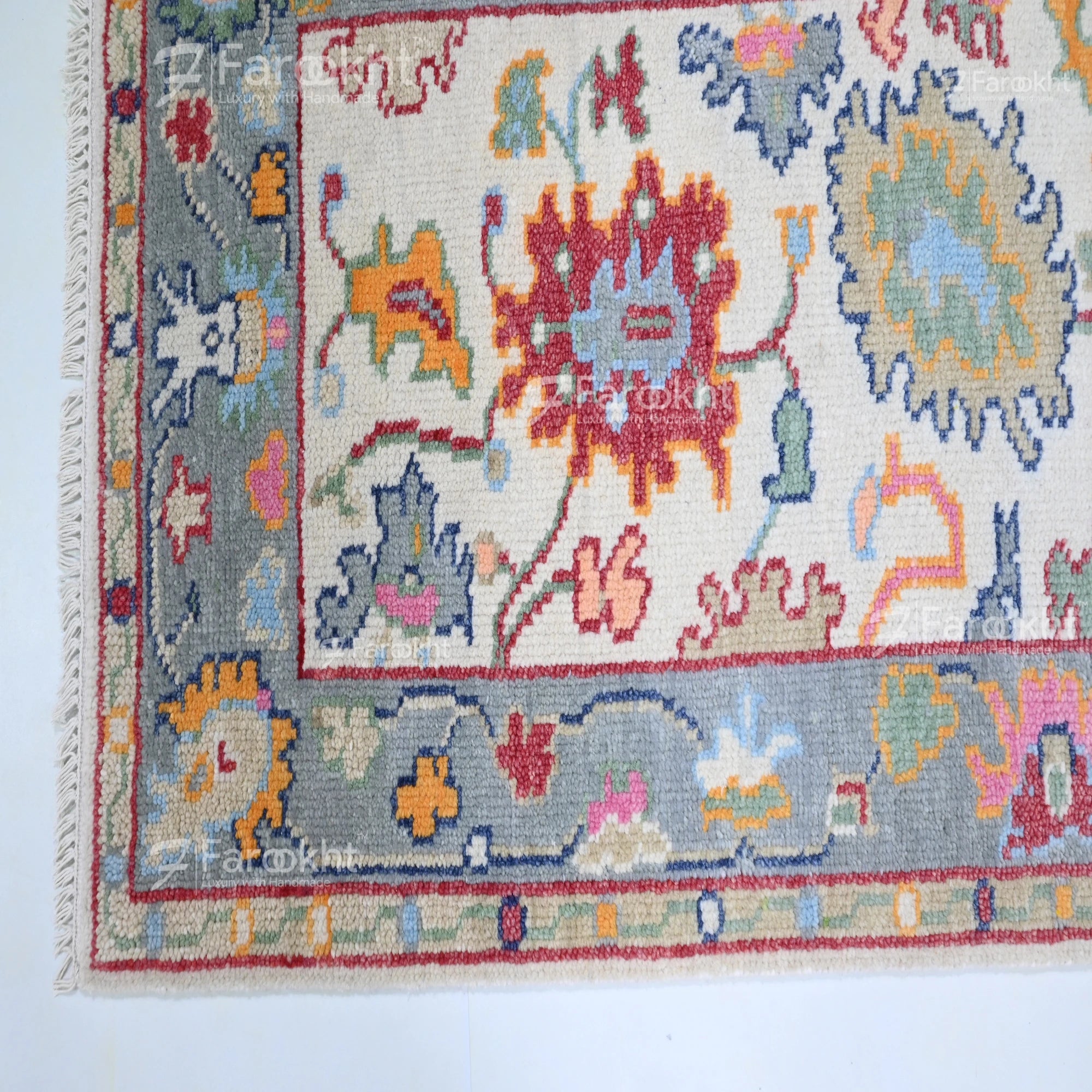 Colorful patterned rug with intricate designs on a white background