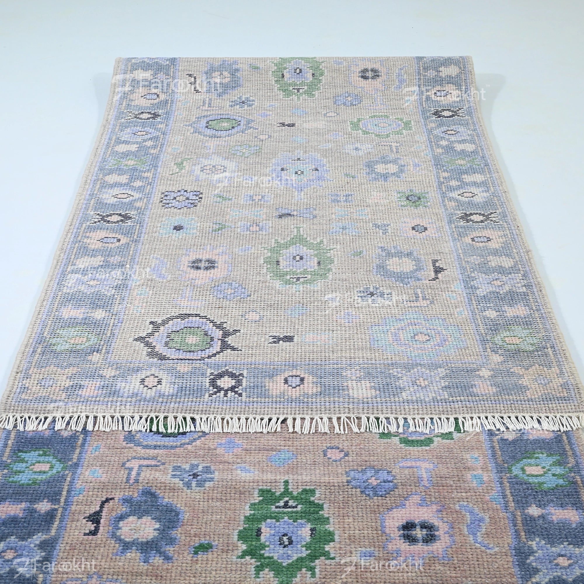 Decorative rug with intricate patterns on a plain background