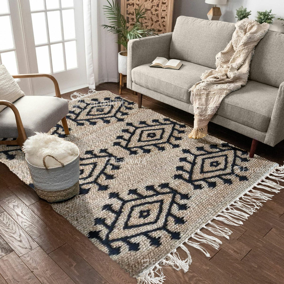 Living room with a patterned rug, gray sofa, and armchair.