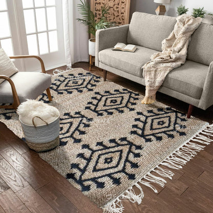 Living room with a patterned rug, gray sofa, and armchair.