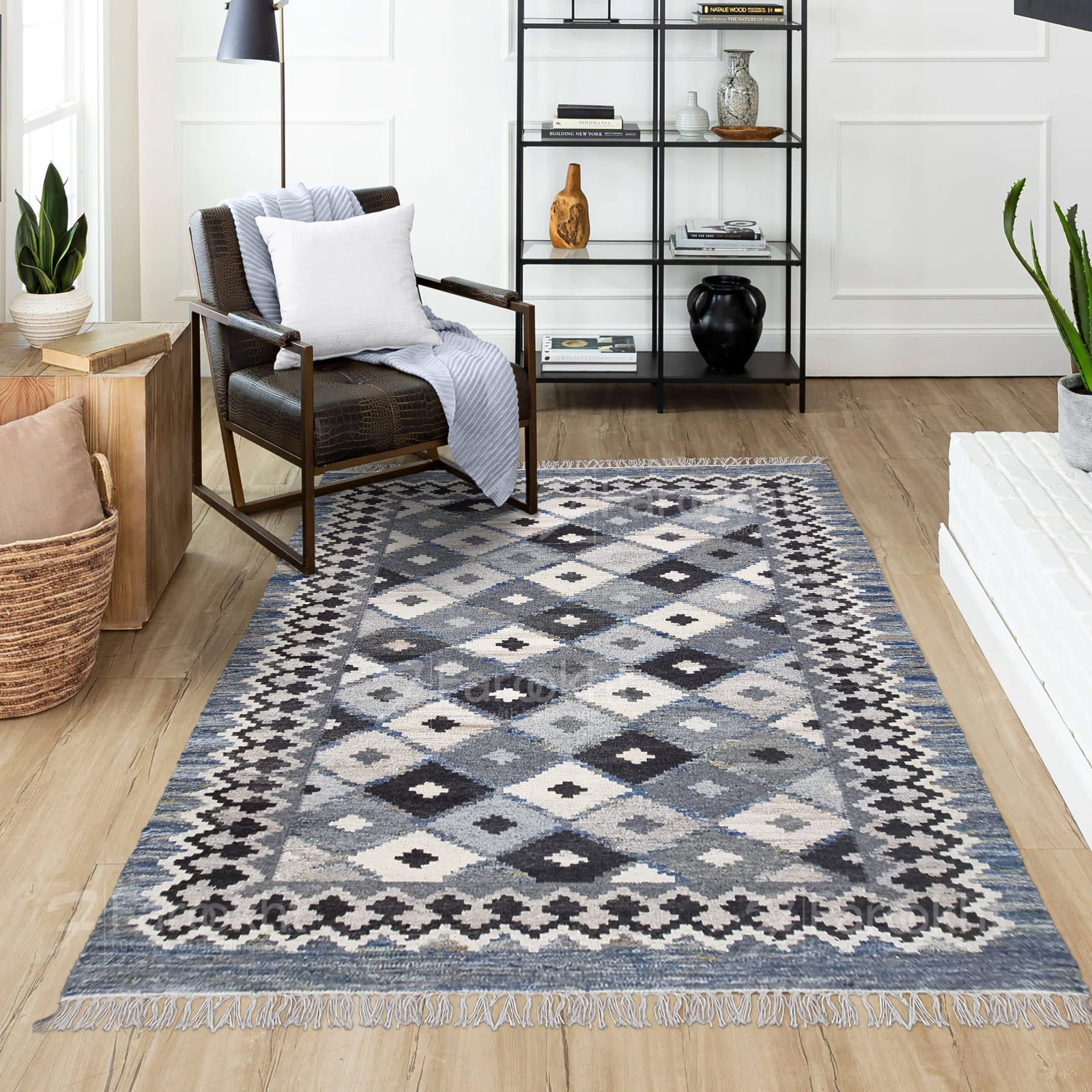 Patterned rug on a wooden floor with a chair and shelves in the background