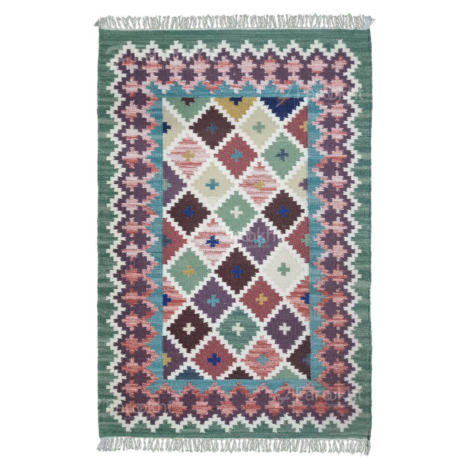 Multicolored geometric patterned rug with fringes on a white background