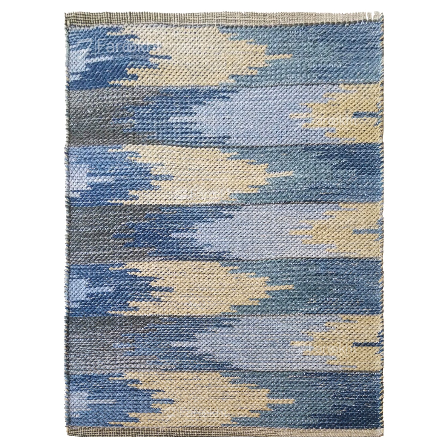 Rectangular rug with blue and beige geometric pattern on a white background