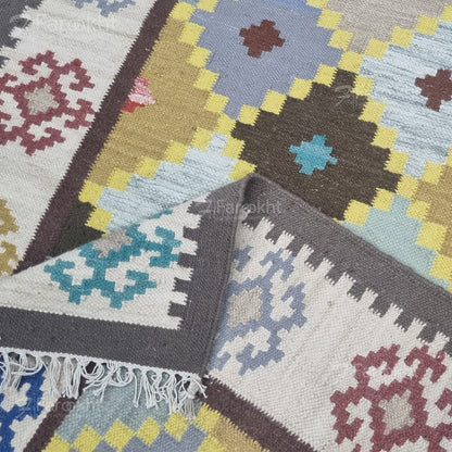 Collection of patterned rugs with geometric designs in various colors.