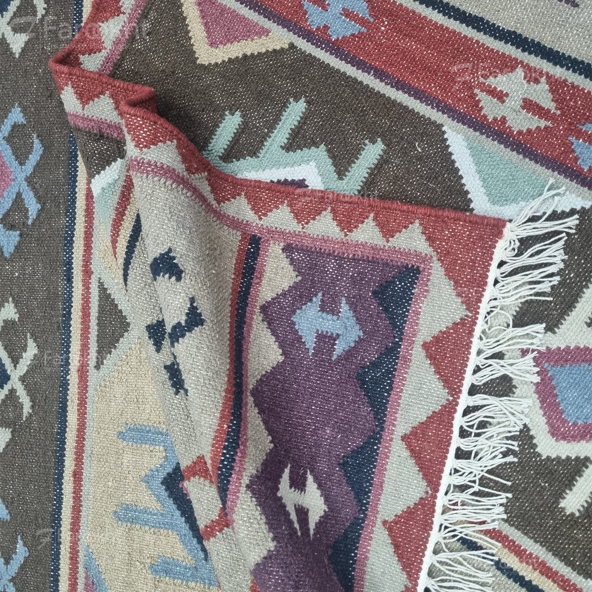 Handwoven Rust Beige Geometric wool-blend rug with teal and purple accents, fringe edges and tribal pattern. Available in multiple sizes for all living spaces