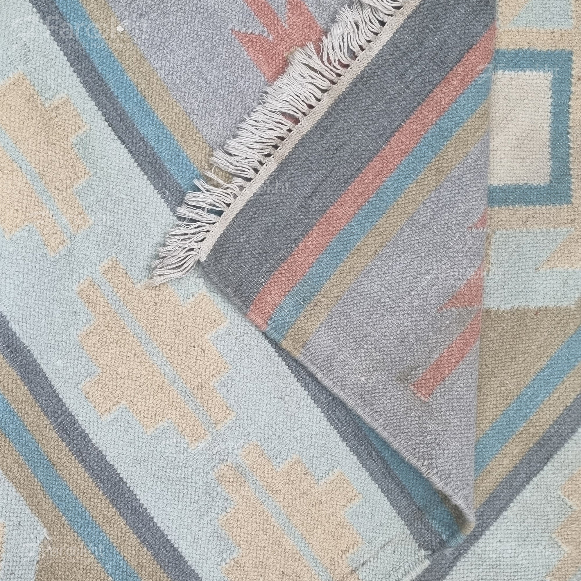 Pastel Flatweave handwoven wool-blend rug, flatweave with coral, mint, and sand tones, finished with short fringes — ideal for living rooms.