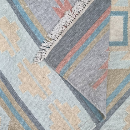 Pastel Flatweave handwoven wool-blend rug, flatweave with coral, mint, and sand tones, finished with short fringes — ideal for living rooms.