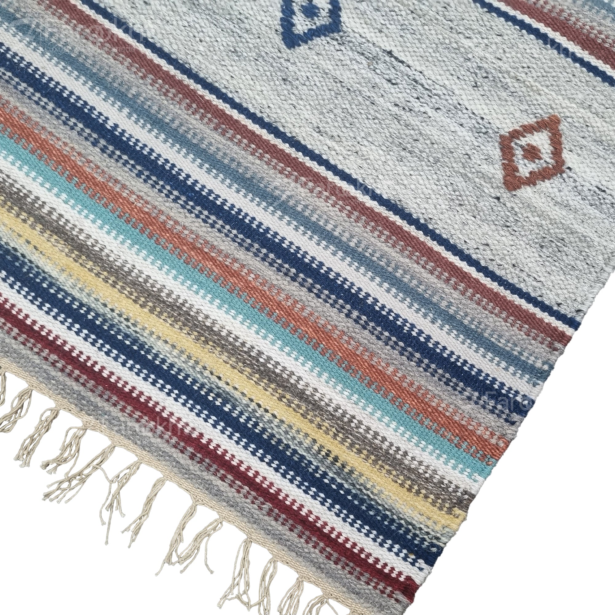 Woven textile with colorful stripes and fringe on a white background