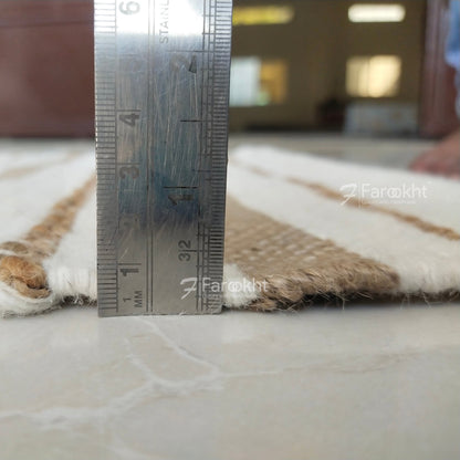 Rug with a ruler for scale on a blurred indoor background