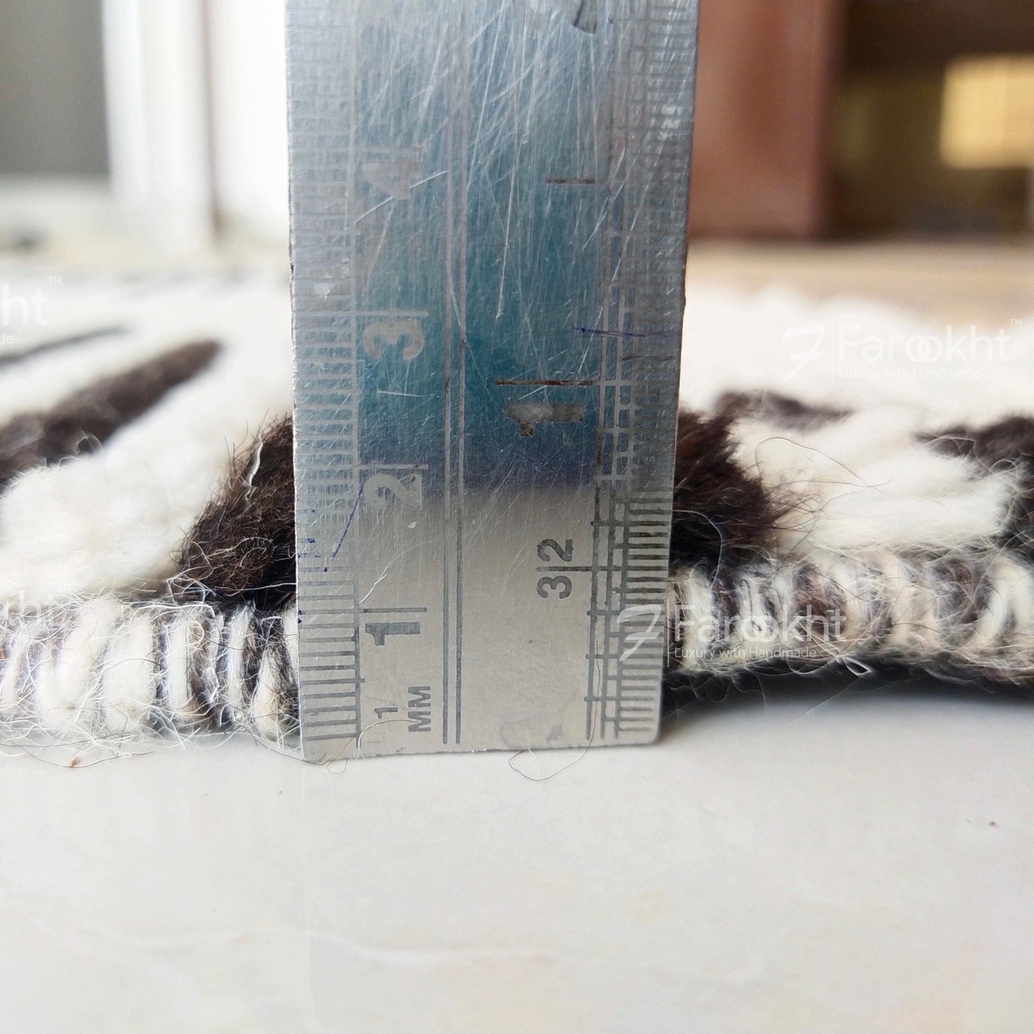 Close-up of a ruler against a textured surface with visible measurement details.