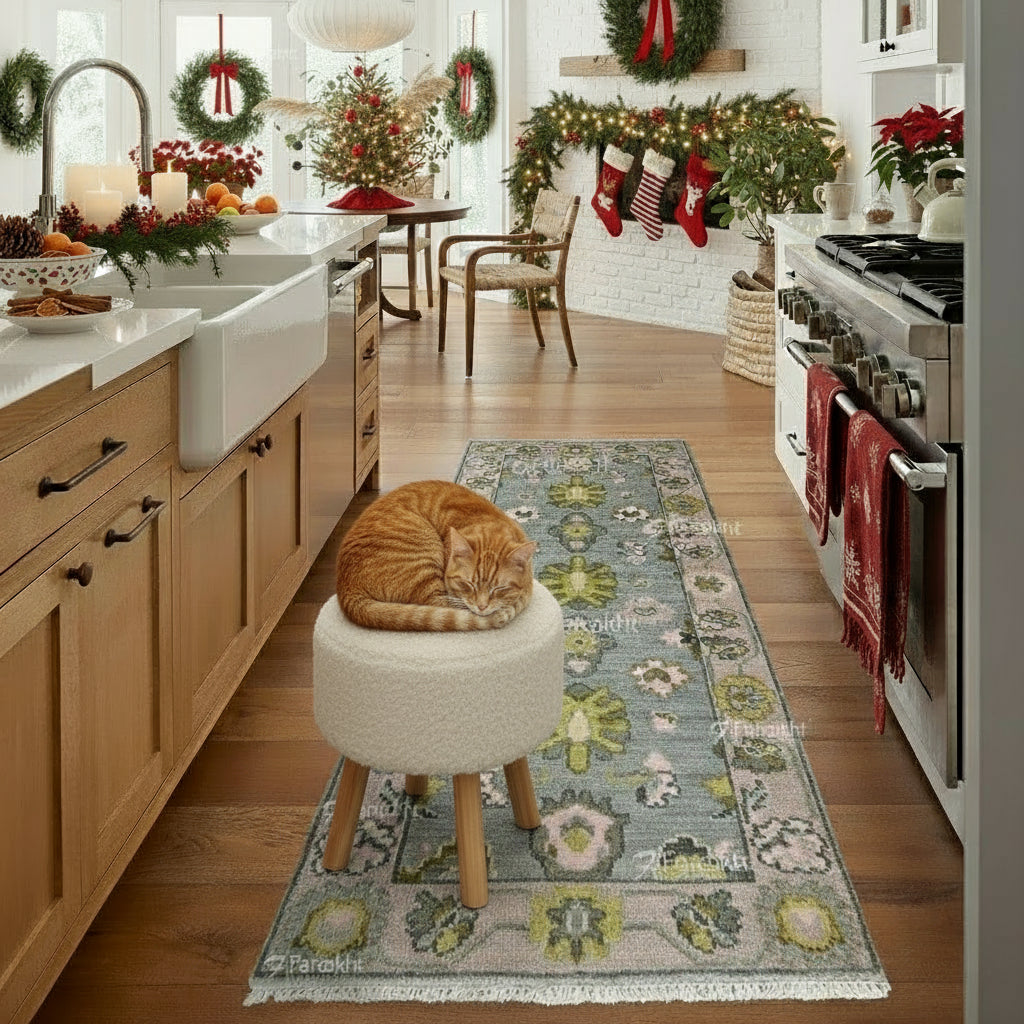 Kitchen with a cat on a stool, decorated for Christmas with wreaths and stockings.