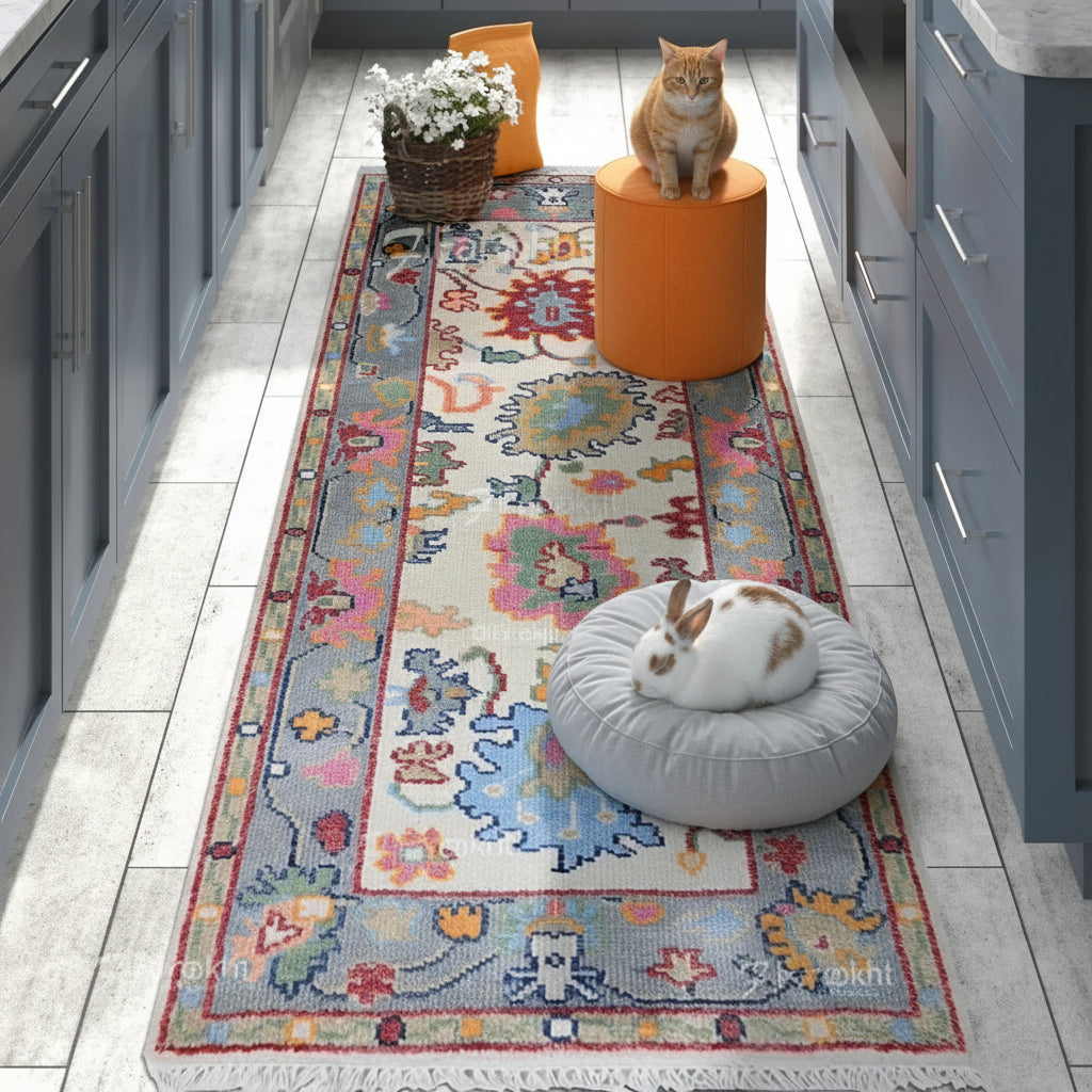 Colorful patterned rug on a tiled floor with a potted plant.
