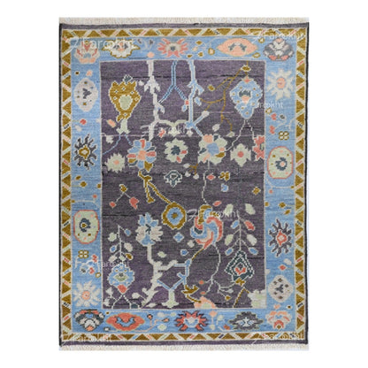 Luxury floral hand-knotted wool rug with pastel blue and gray color palette