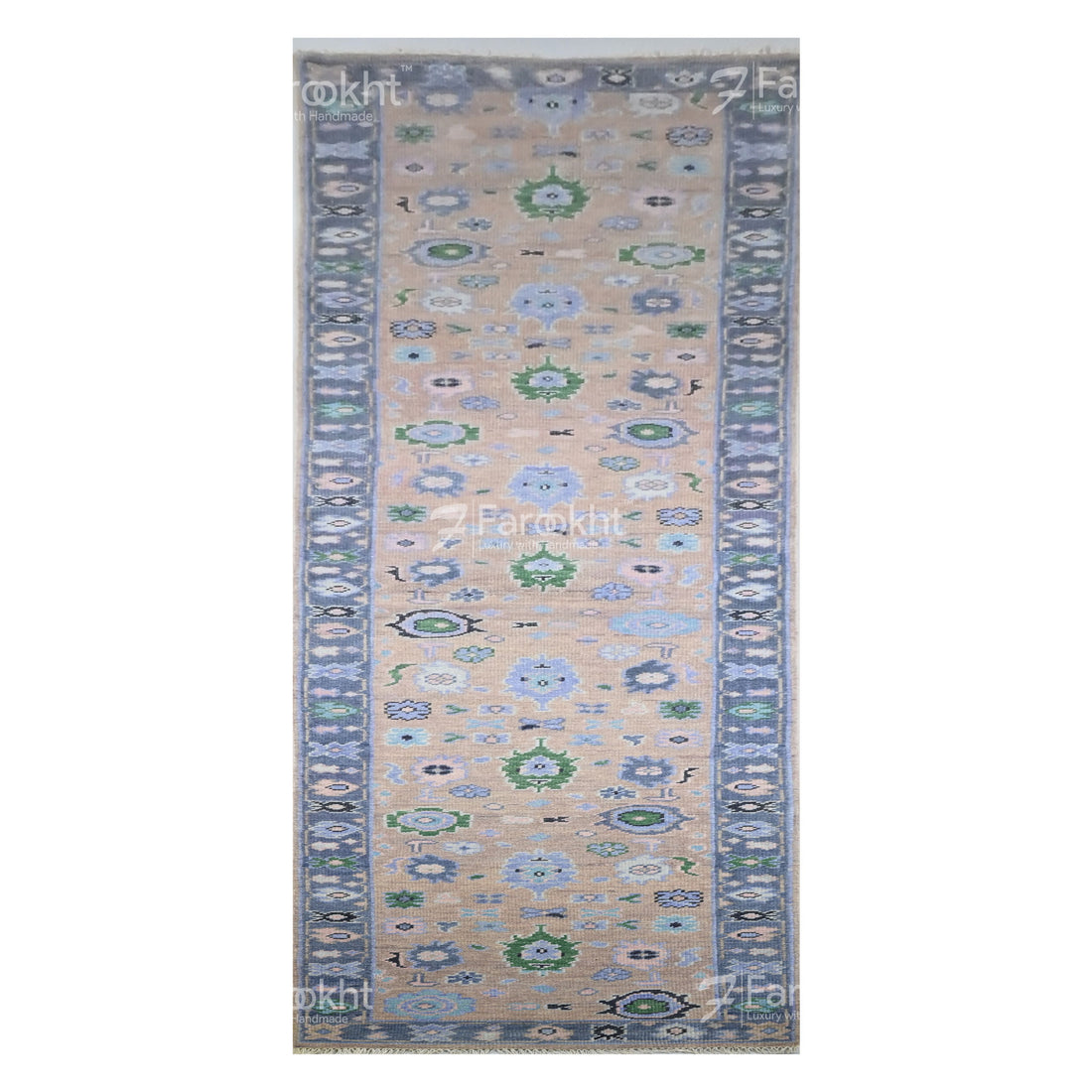 Decorative rug with floral patterns on a beige background, featuring the brand &