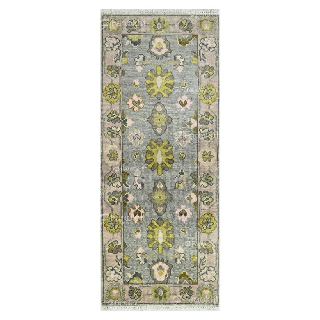 Floral patterned rug with green and pink flowers on a gray background