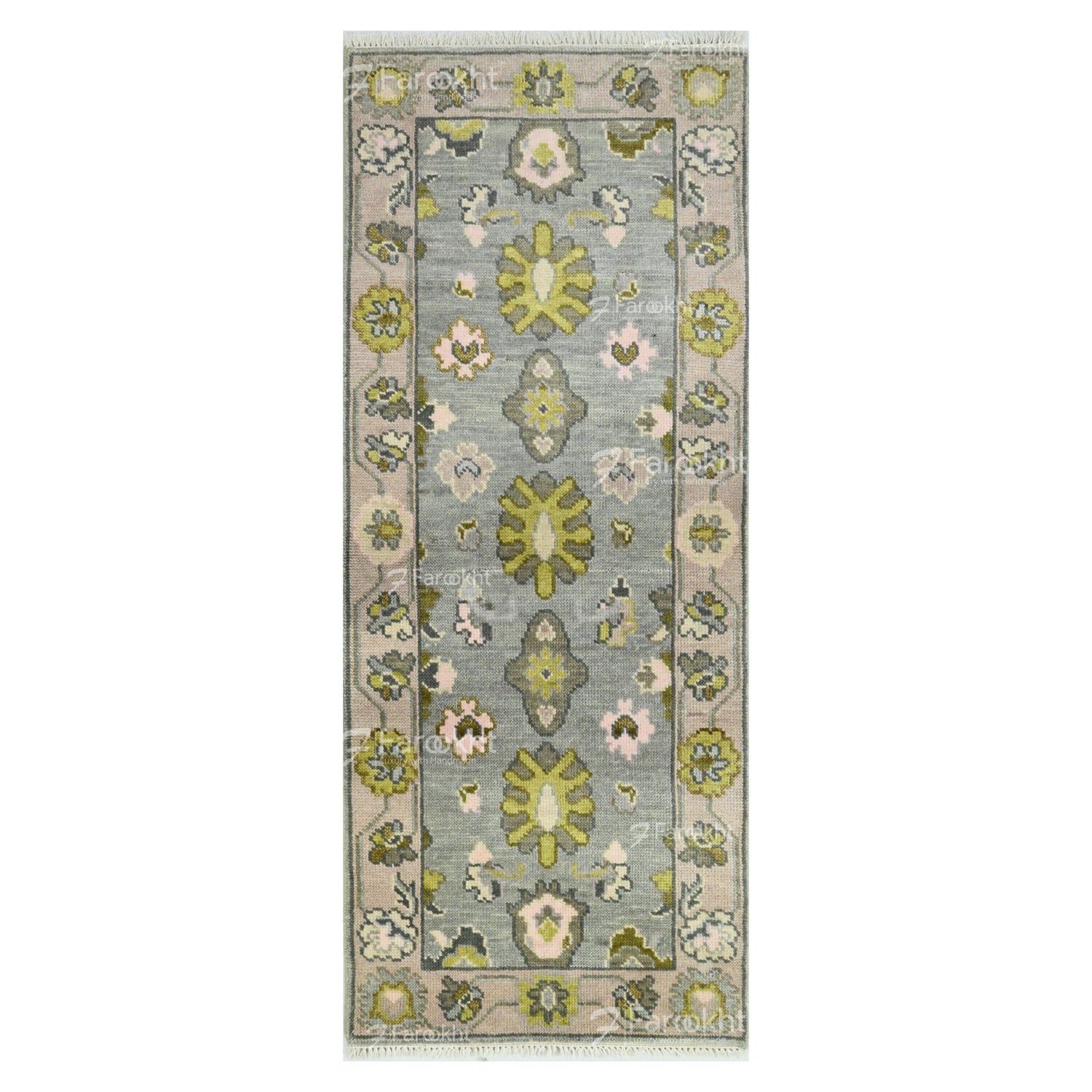 Floral patterned rug with green and pink flowers on a gray background