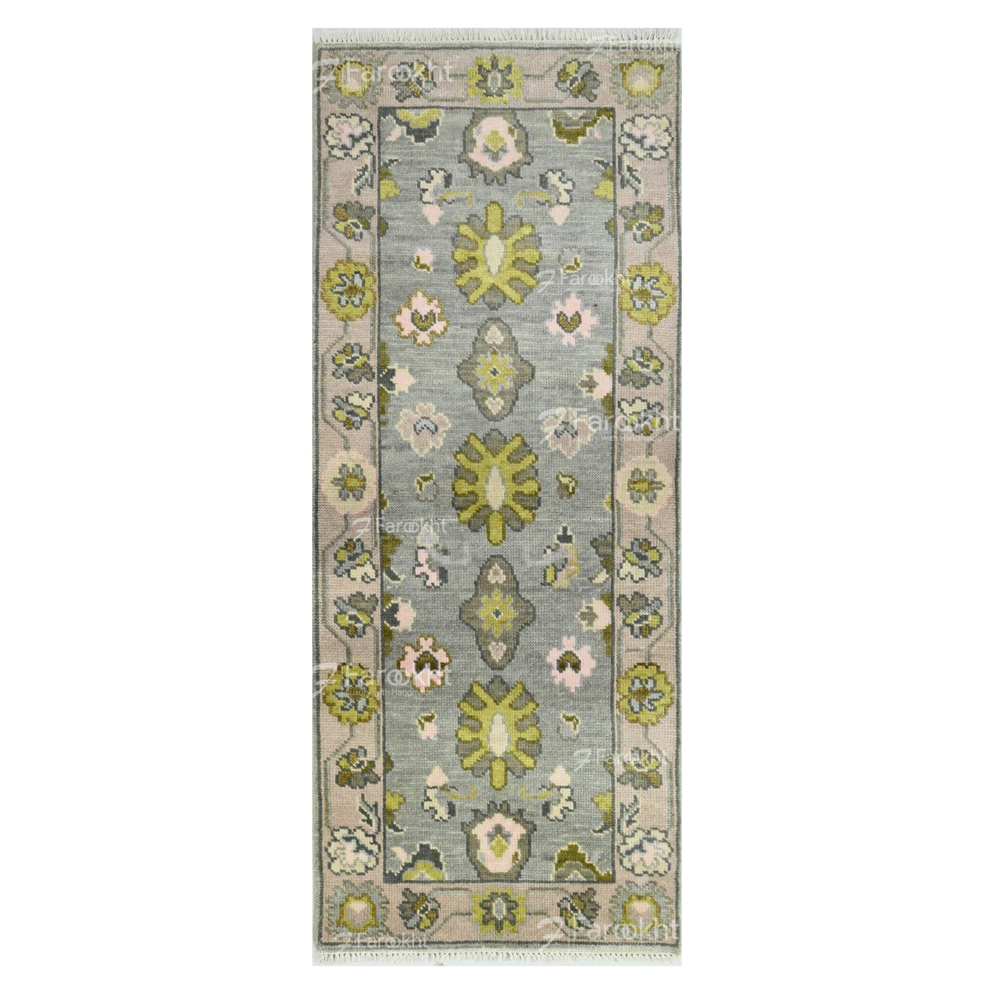 Floral patterned rug with green and pink flowers on a gray background