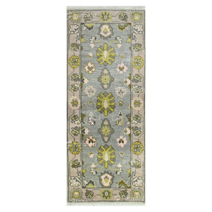 Floral patterned rug with green and pink flowers on a gray background