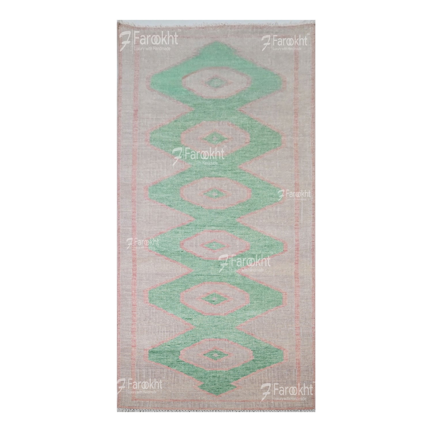 Rug with green geometric pattern on a white background