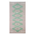 Rug with green geometric pattern on a white background