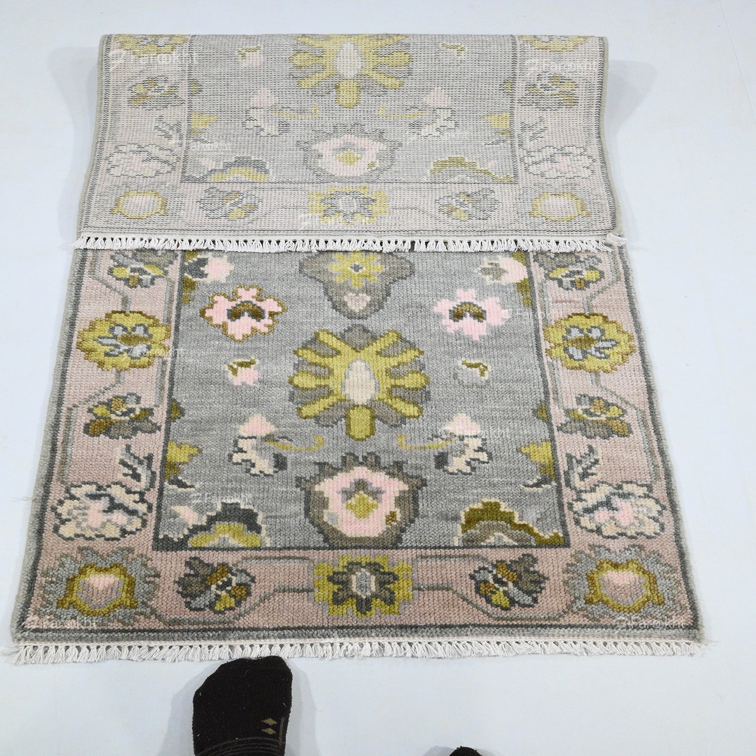 Floral patterned rug on a white background