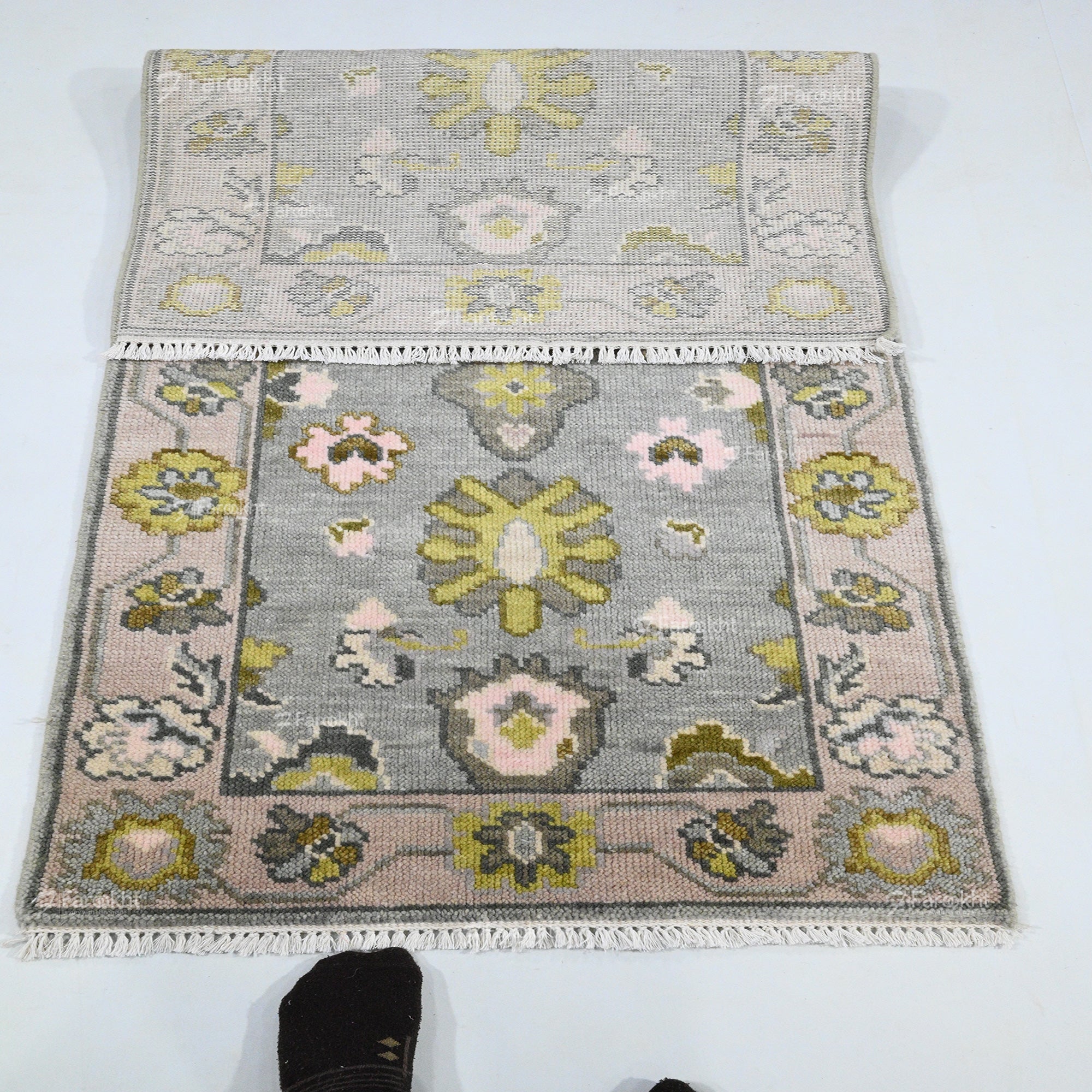 Floral patterned rug on a white background