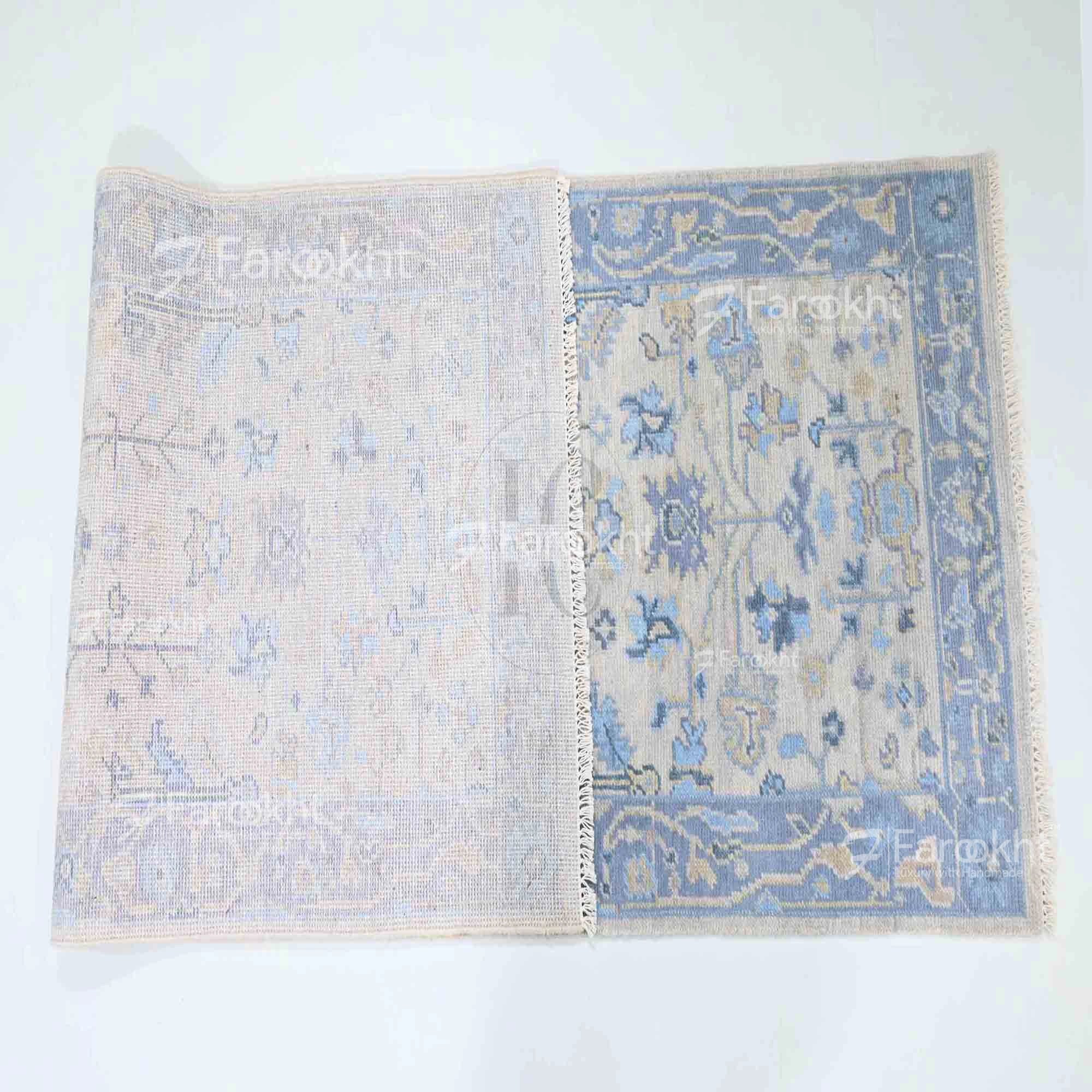 Two floral-patterned rugs on a white background with &
