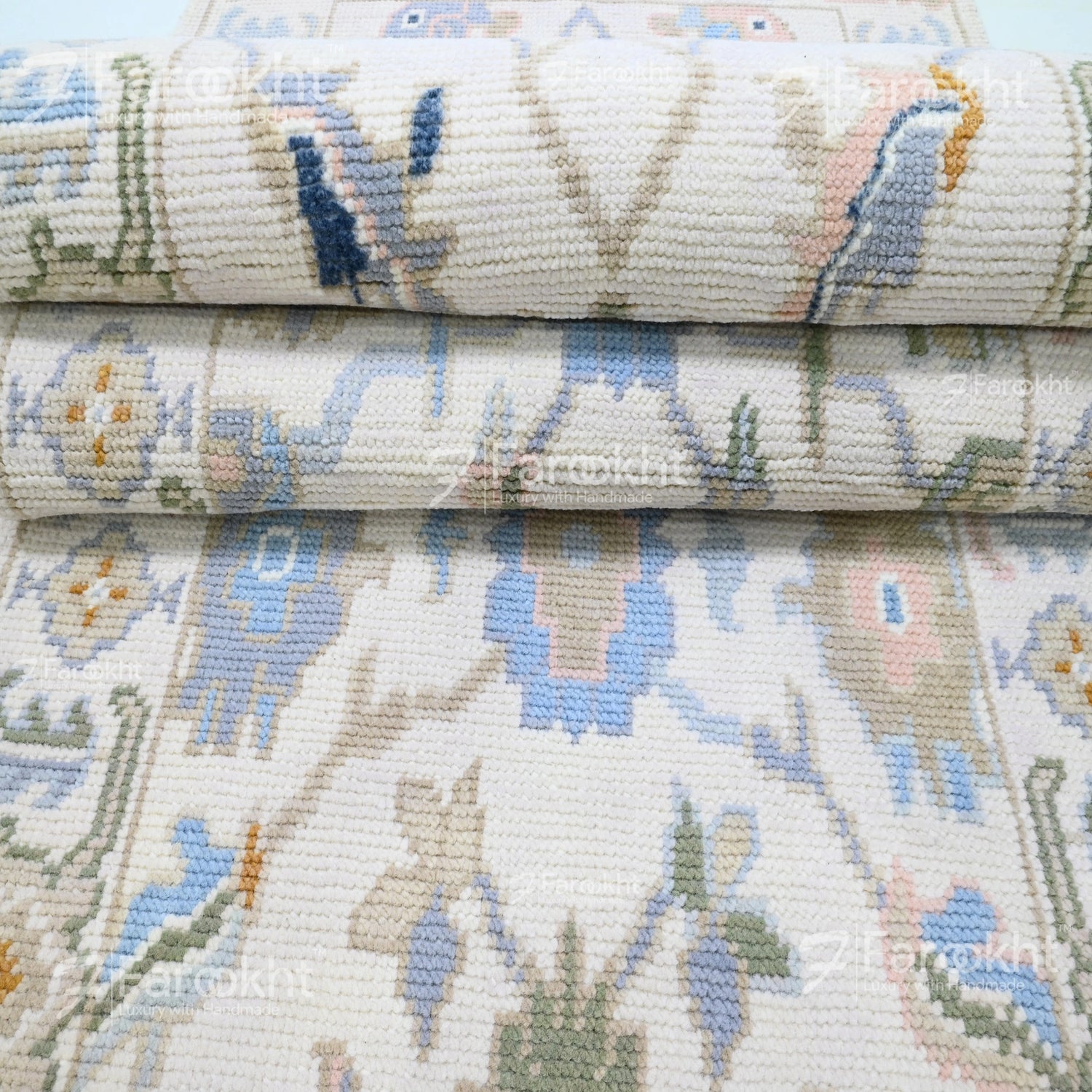Close-up of a stack of patterned fabric rolls with floral designs.