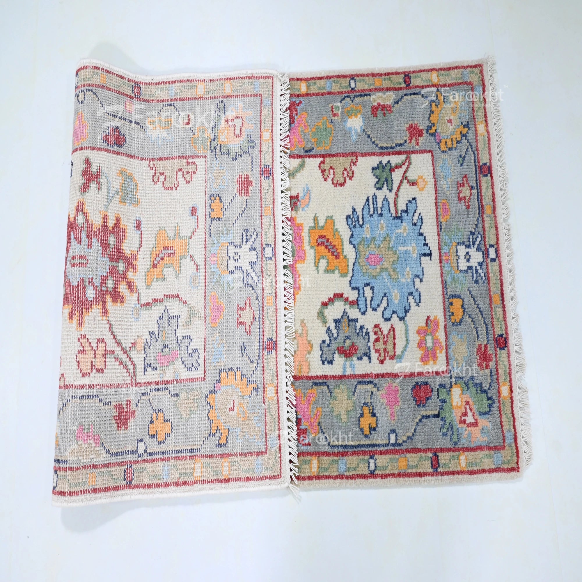 Two patterned rugs displayed side by side on a white background