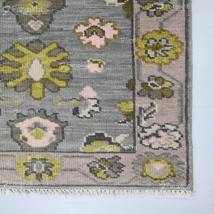 Floral patterned rug with a gray background