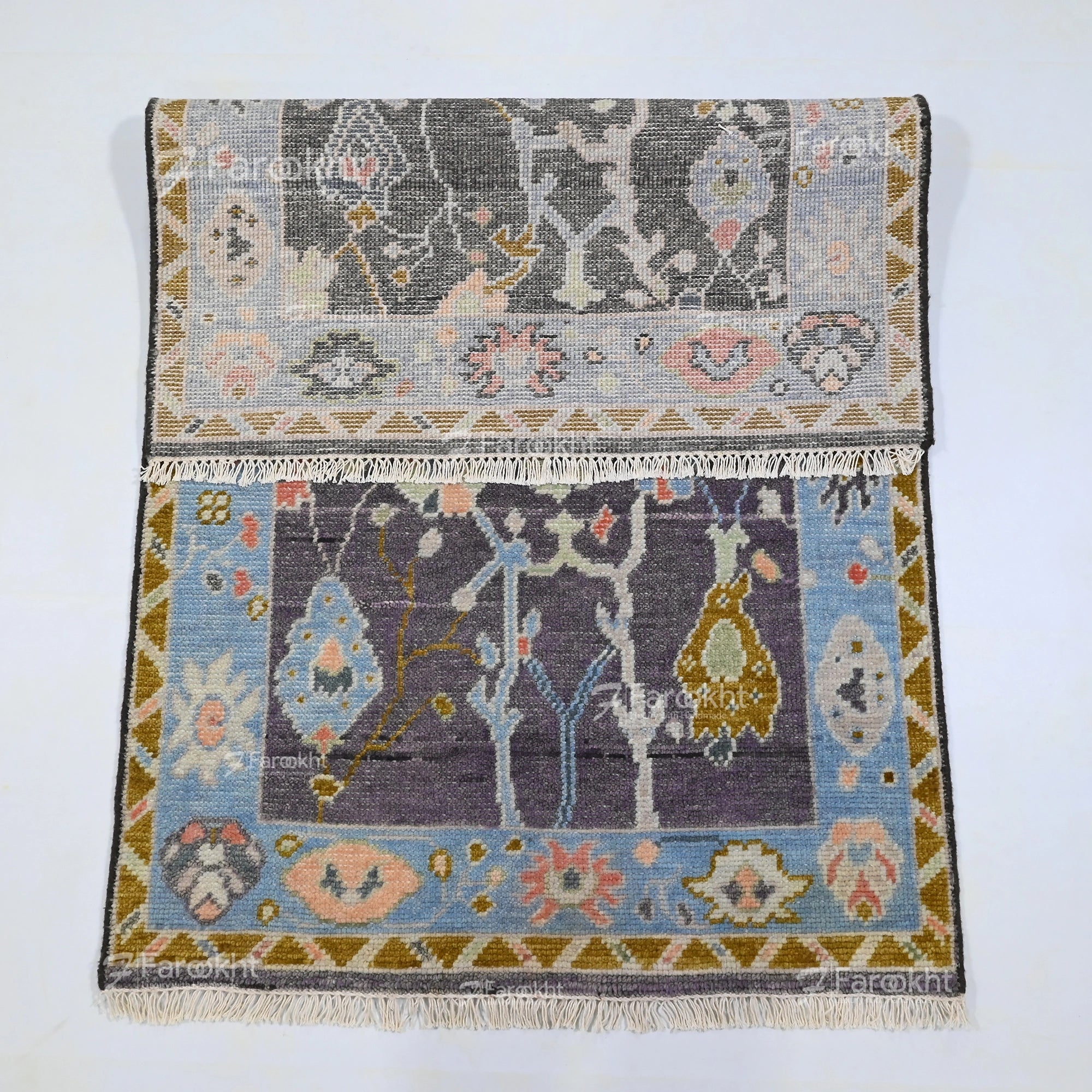 Traditional floral wool blend area rug with blue and gray tones handmade for modern homes