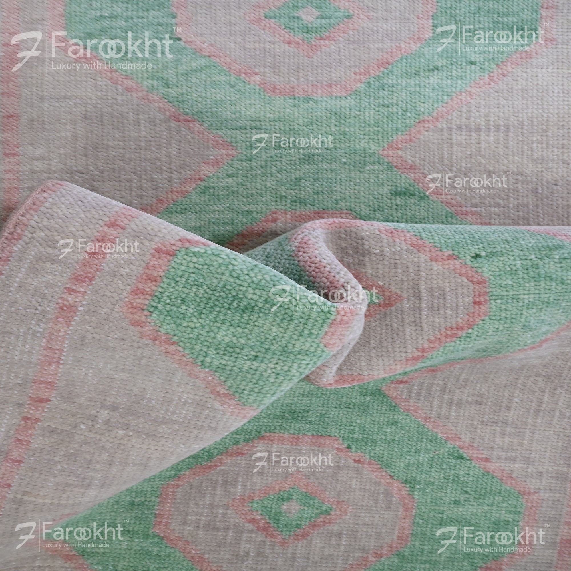 Close-up of a patterned fabric with geometric design, featuring green and red colors.