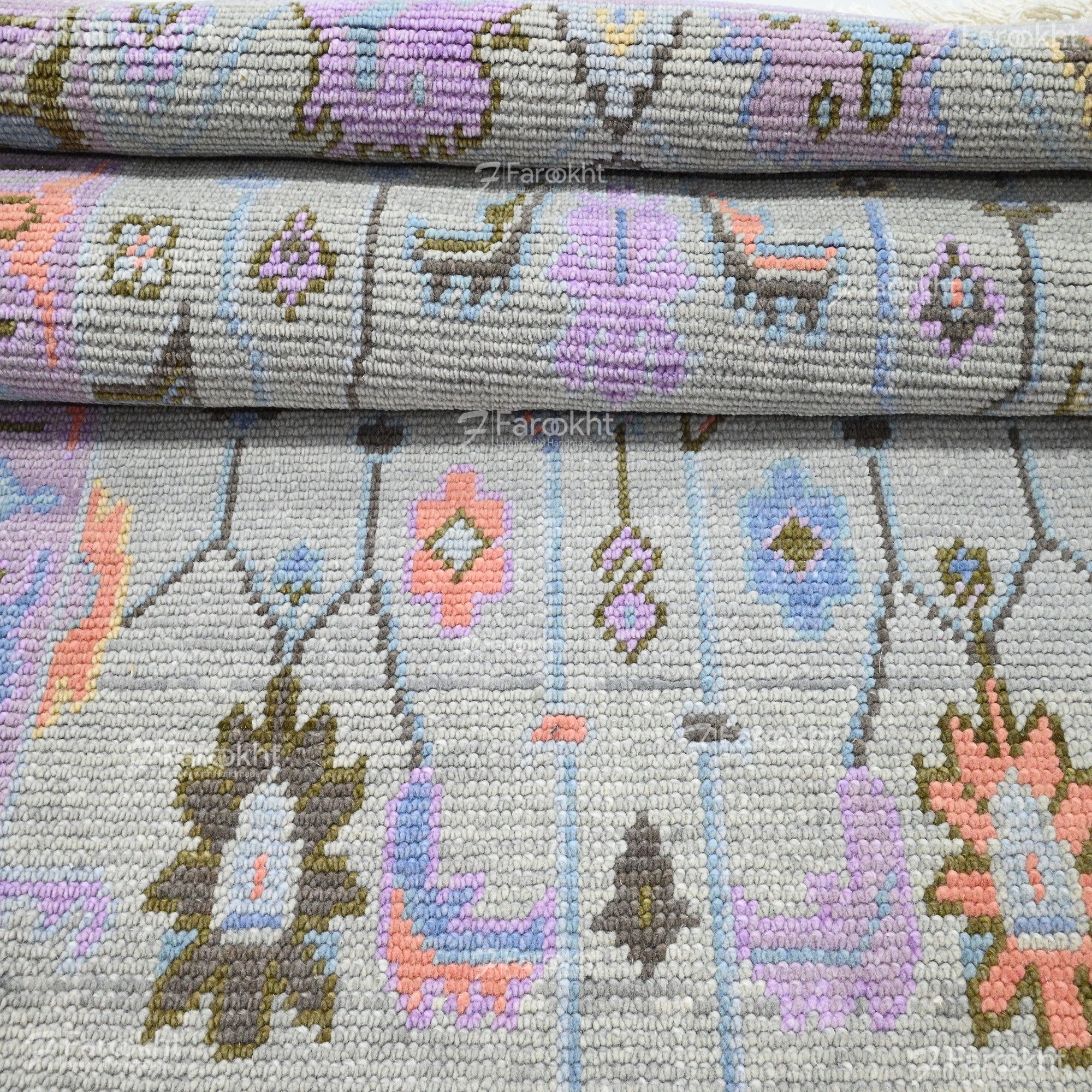 traditional pastel colored rug with floral Oushak motifs