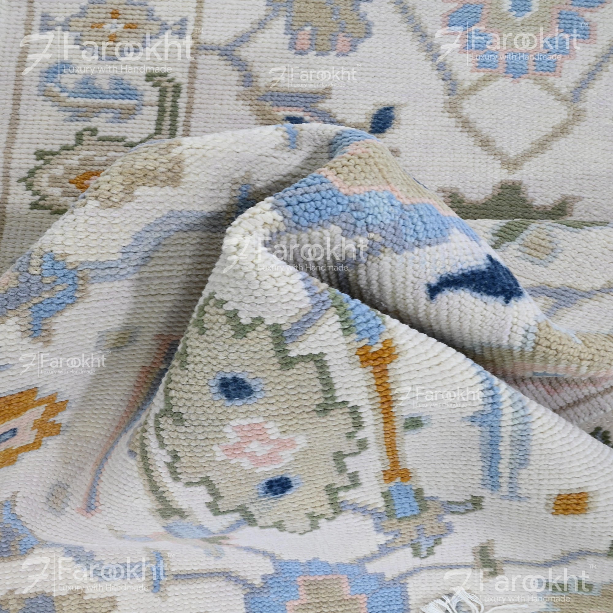 Ivory hand-knotted hallway runner rug with sky blue, blush pink, sage green, and lavender floral motifs on wool blend.