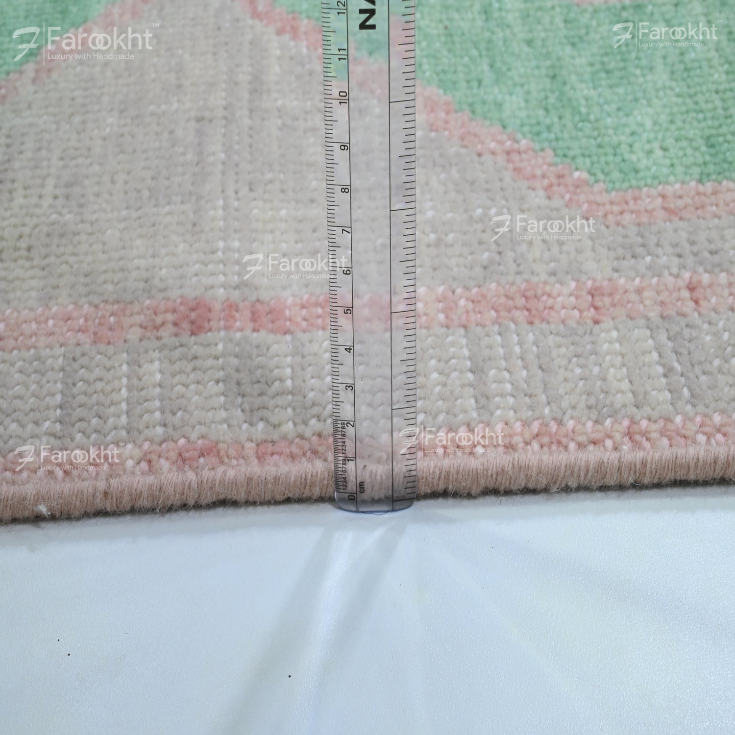 Rug with a ruler for scale on a white background