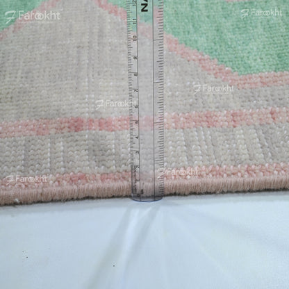 Rug with a ruler for scale on a white background