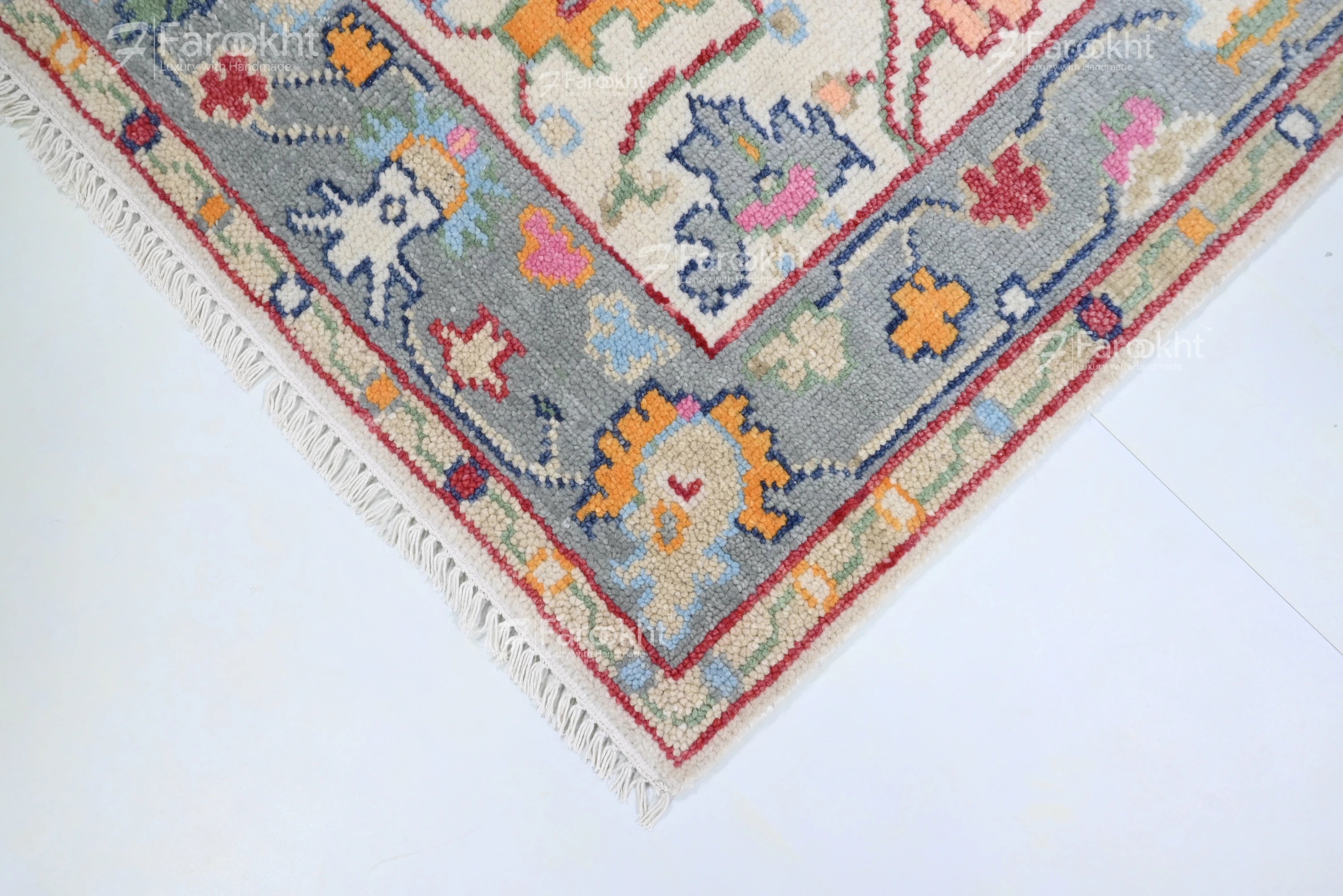 Decorative rug with colorful patterns on a white floor