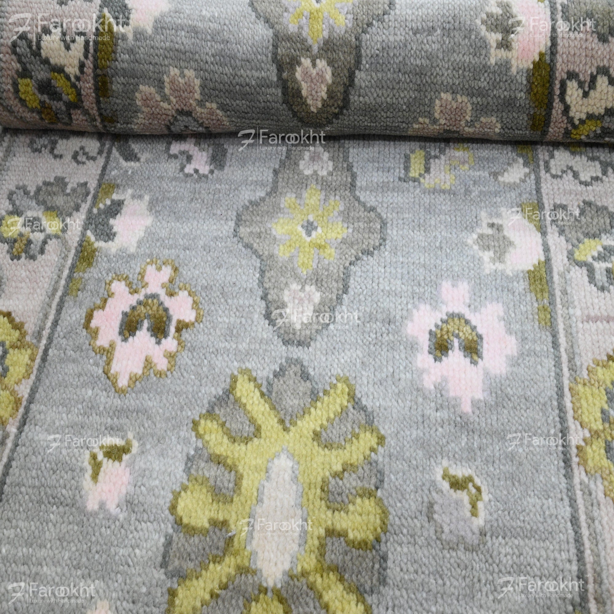 Close-up of a floral-patterned fabric with visible branding.
