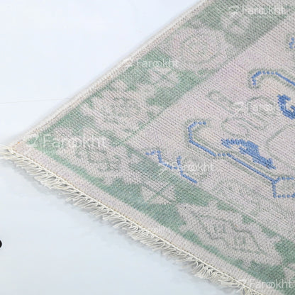 Textured rug with geometric pattern on a white background