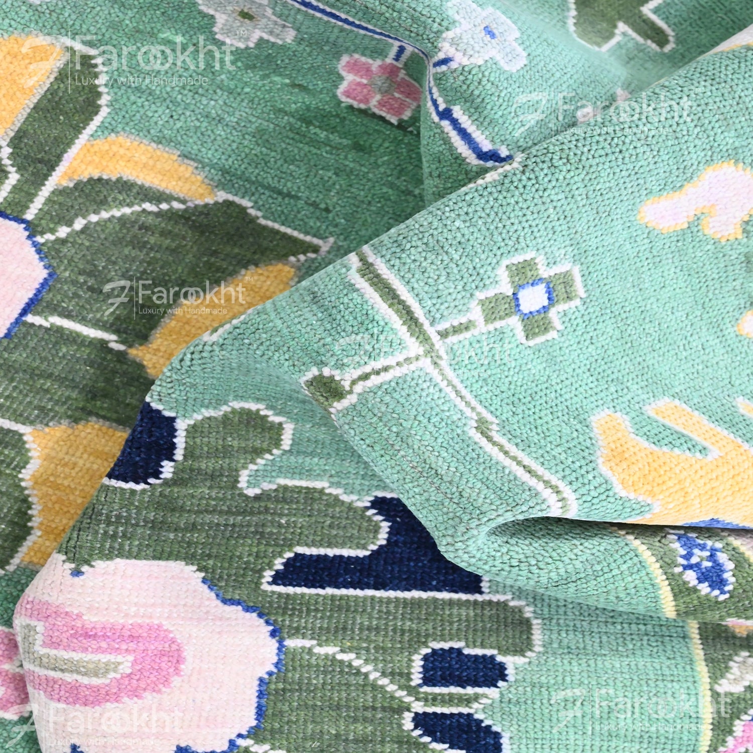 Close-up of a patterned fabric with floral and geometric designs.